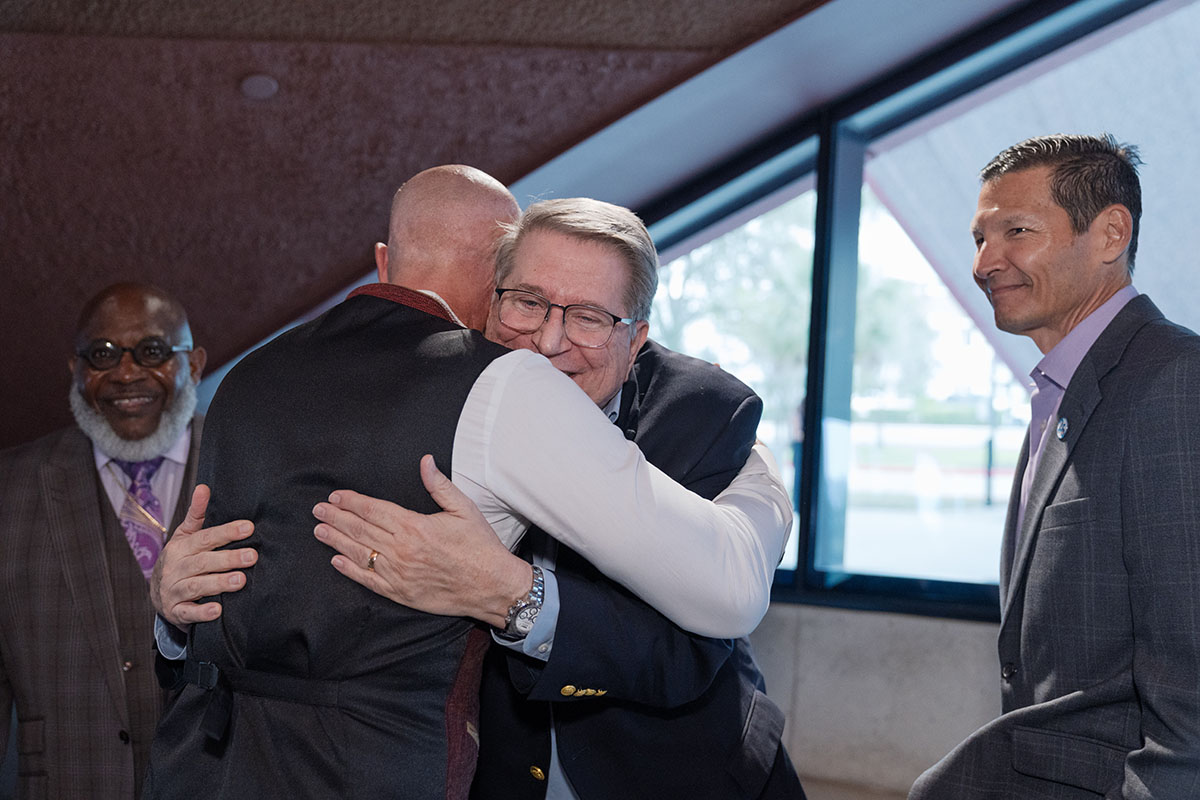 men embrace